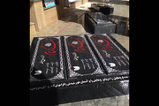 خانواده شهید مدافع حرم برای شهدای گمنام سنگ گلزار نصب کردند
