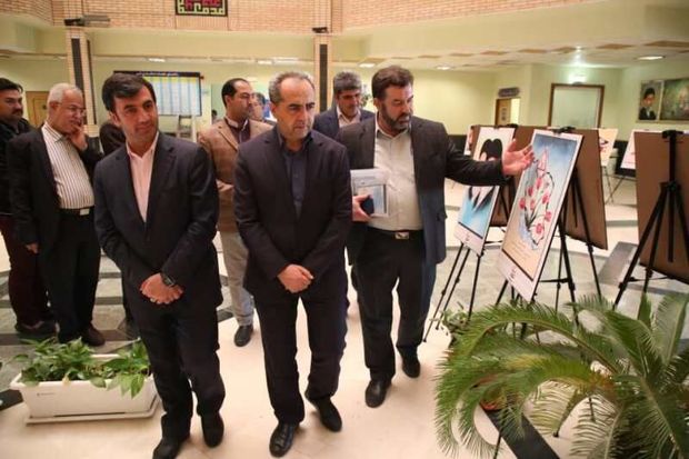 نمایشگاه پوستر مفهومی پدافند غیرعامل درقم برپا شد