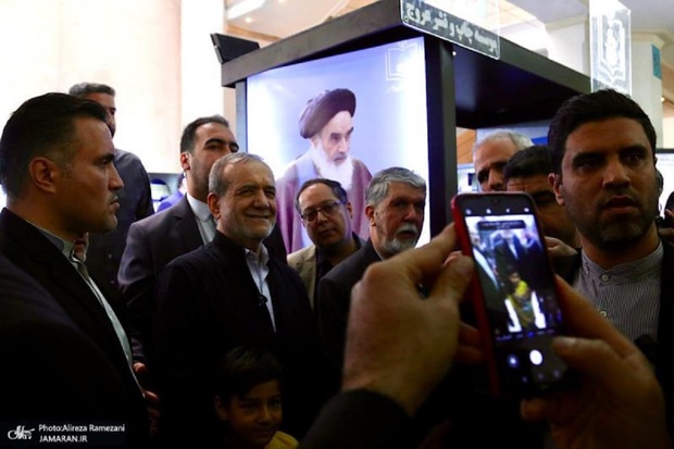 Iranian president visits stall displaying Imam Khomeini's works at book exhibition